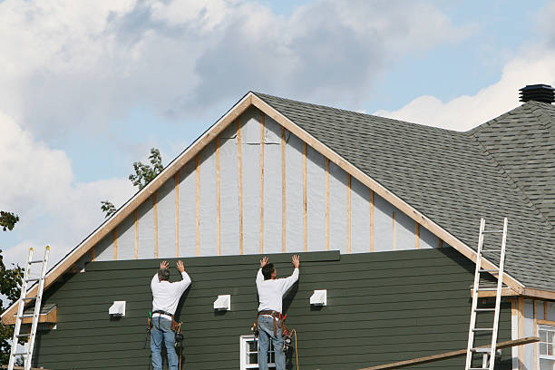 Professional Siding technician working in Whitsett, NC